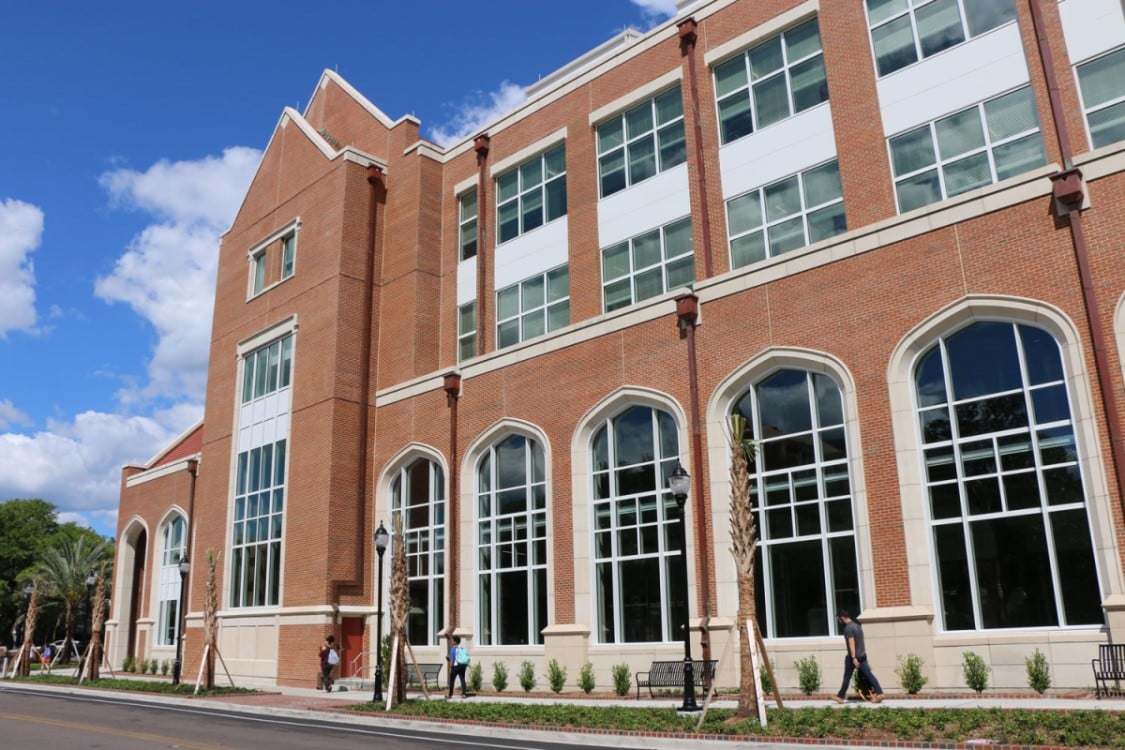outside of chemistry building with students walking by big windows