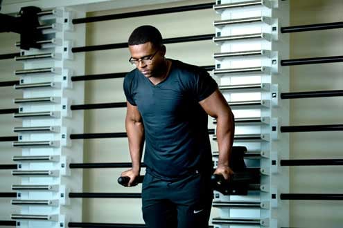 A male student doing dips as strength exercising at the Southwest Recreation Center