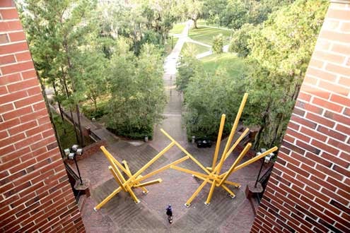 The French Fries statue on the UF campus photographed by drone. This sculptures name is really Alachua, but students nicknamed it the French fries because the art does resemble two large clumps of yellow fries