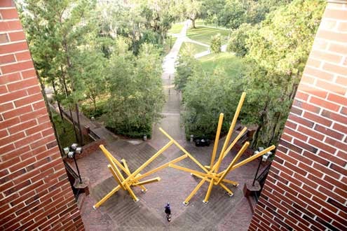 The French Fries statue on the UF campus photographed by drone. This sculptures name is really Alachua, but students nicknamed it the French fries because the art does resemble two large clumps of yellow fries