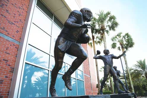 Large, life-like statues of Heisman trophy winners Steve Spurrier, Danny Wuerffel and Tim Tebow located outside Ben Hill Griffin Stadium on the UF campus
