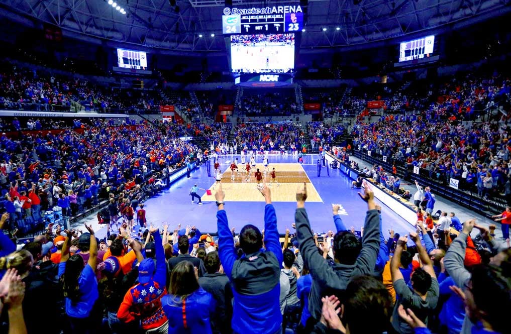 people cheer during a volleyball game inside the Center